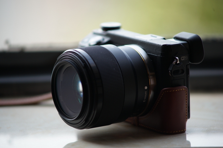 这个小痰盂略贵索尼fe50f18